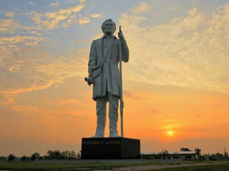 Giant of the Prairie Stephen F. Austin statue sunset Angleton Texas — family law attorney Angleton TX