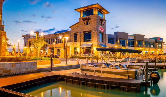 Cypress Texas Towne Lake waterfront retail at dusk — child custody attorney Houston TX serving Cypress and Cy-Fair ISD custody cases