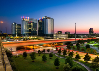 Energy Corridor Houston Texas at dusk with I-10 light trails — child custody attorney Houston TX serving Energy Corridor international relocation custody cases
