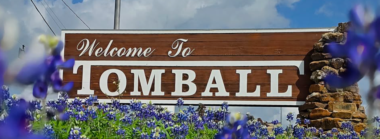 Welcome to Tomball Texas sign with bluebonnets — family law attorney Tomball TX
