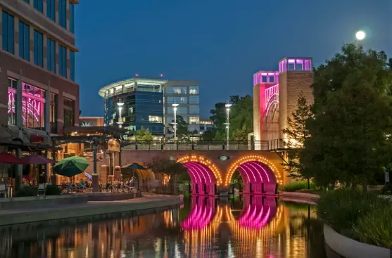 The Woodlands Town Center Waterway at night — Fritz and Phillips family law attorneys serving The Woodlands, TX